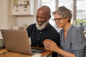 Couple using laptop