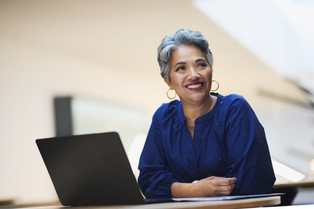 older female worker on laptop